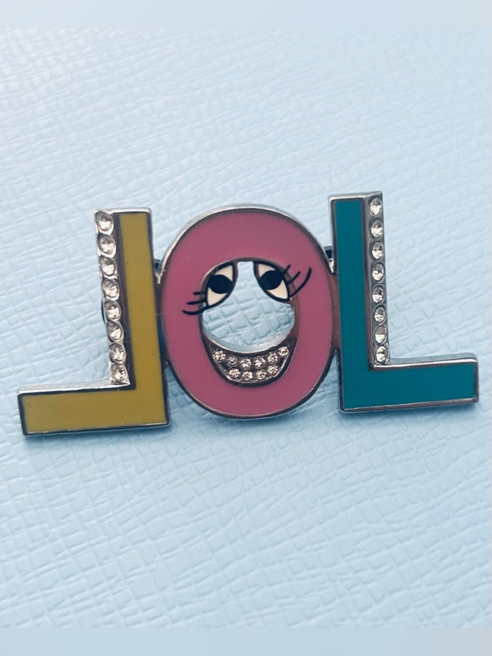 Henri Bendel “LOL” pin